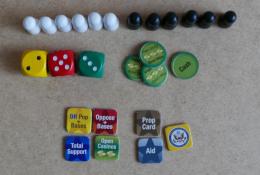 Různé komponenty, které umísťujete na herní desku. A kostky.