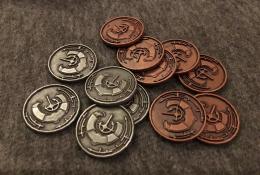 Mince, které přidávají na ceně golemům (bronzové za tři body, stříbrné za jeden).